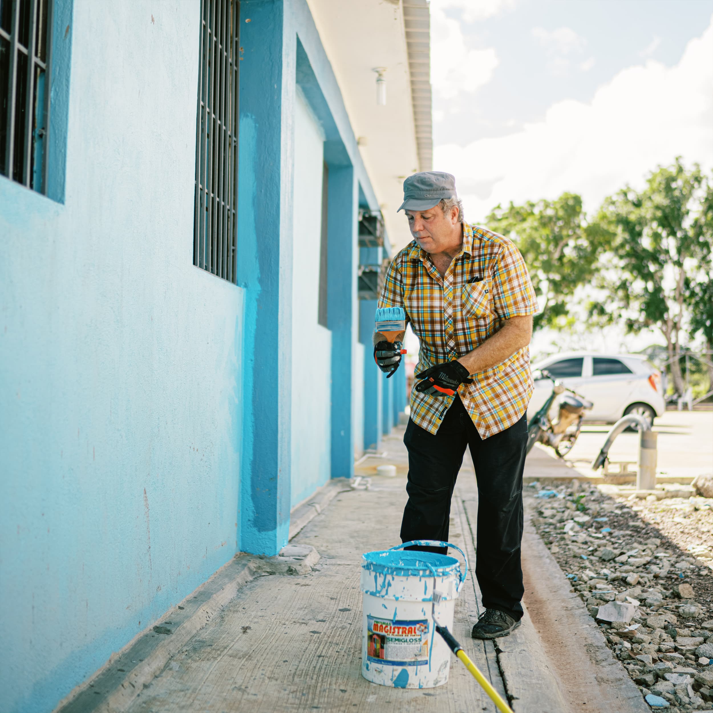 A Community of Hope International volunteer walking through a clinic.