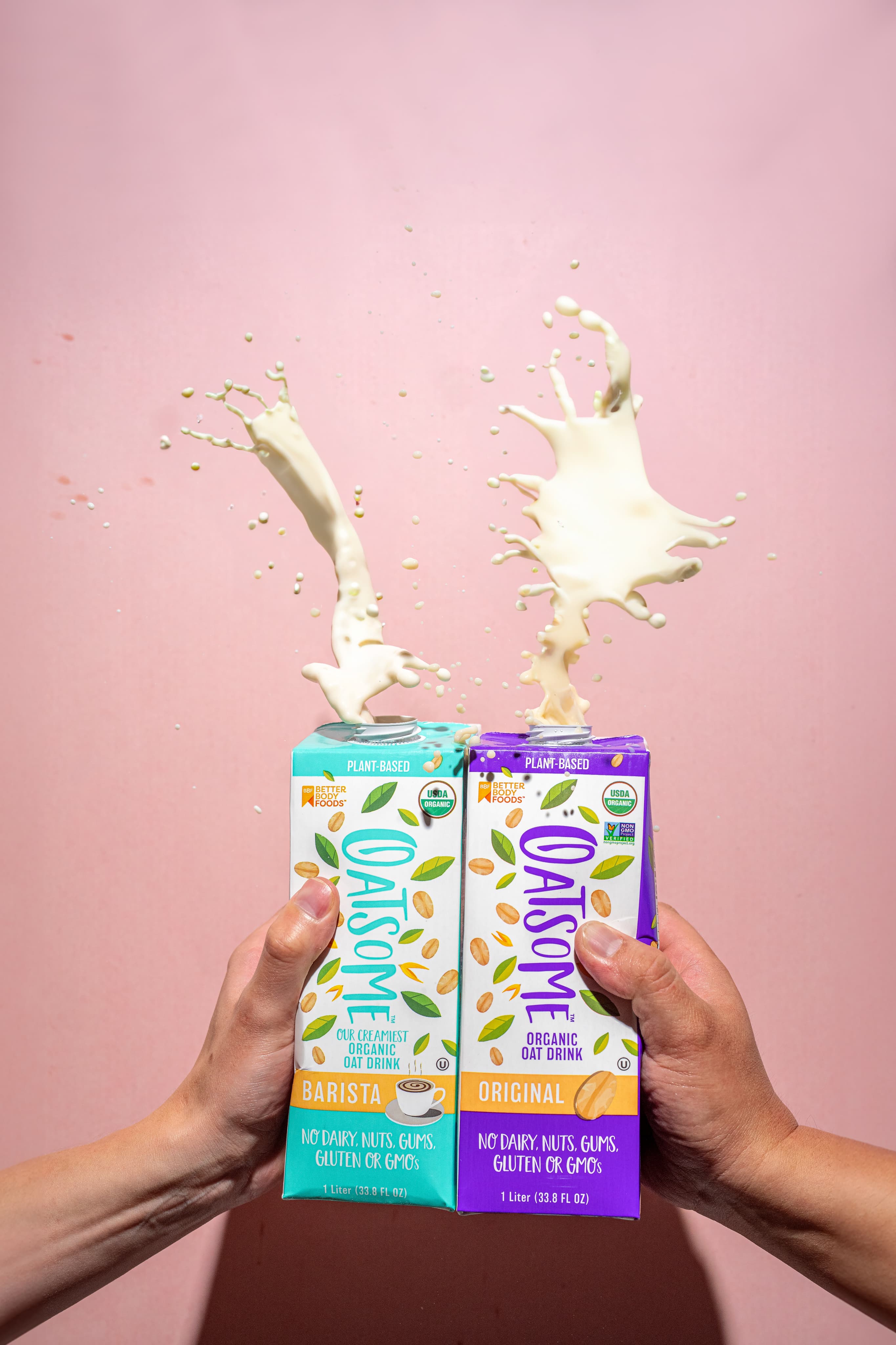 Oatsome product splash with oat milk.