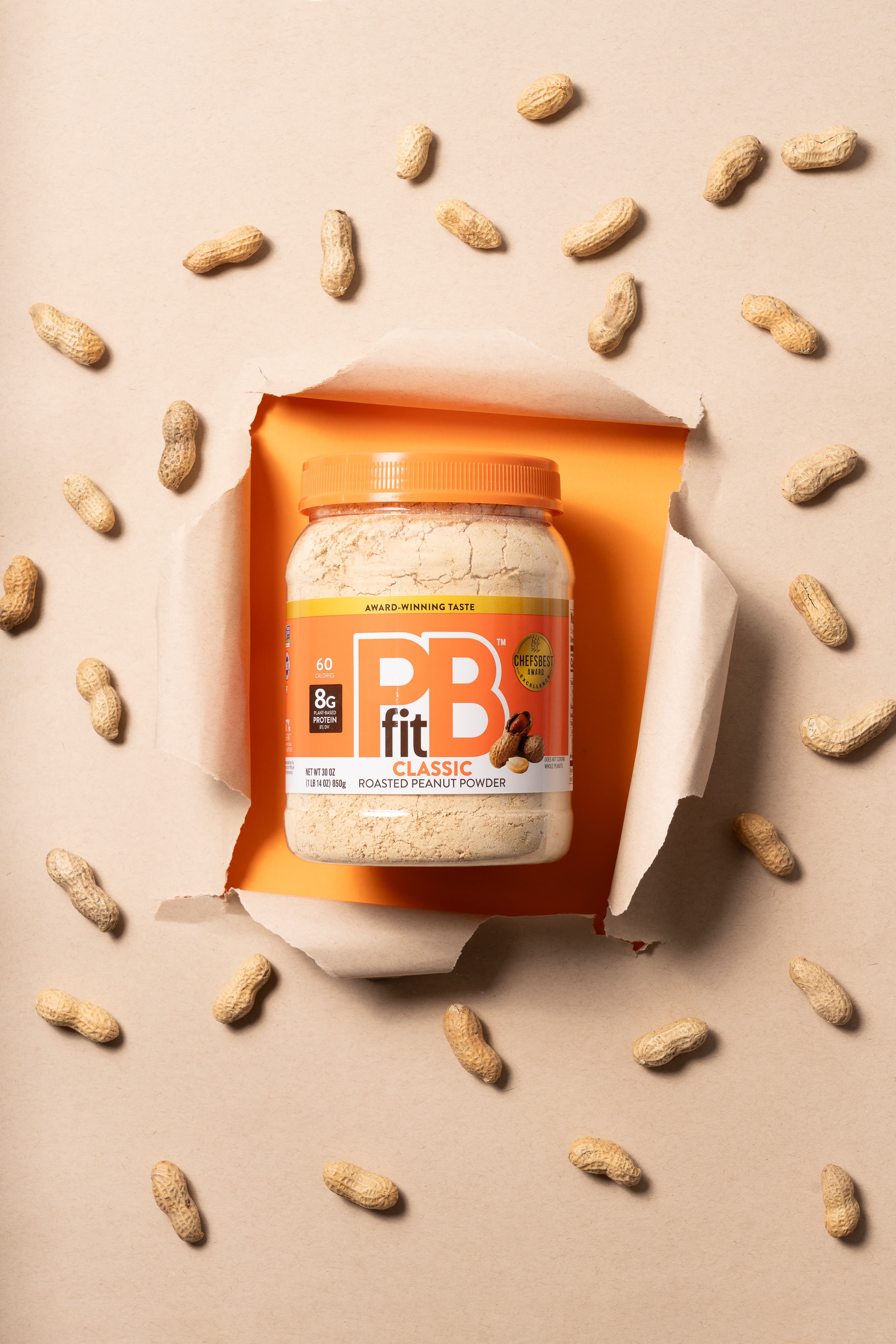 PBfit product jar with fresh ingredients.